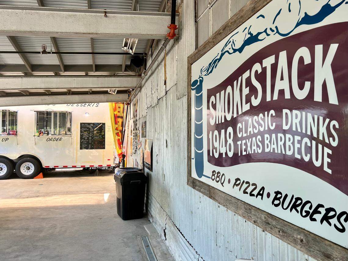 The barbecue trailer is adjacent to the Smokestack 1948 bar and patio.
