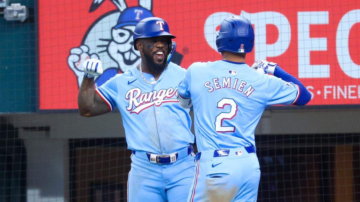 Jun 9, 2024; Arlington, Texas, USA; Texas Rangers second base Marcus Semien (2) celebrates with Texas Rangers right fielder Adolis Garcia (53) after hitting a home run during the second inning against the San Francisco Giants at Globe Life Field. Mandatory Credit: Kevin Jairaj-USA TODAY Sports