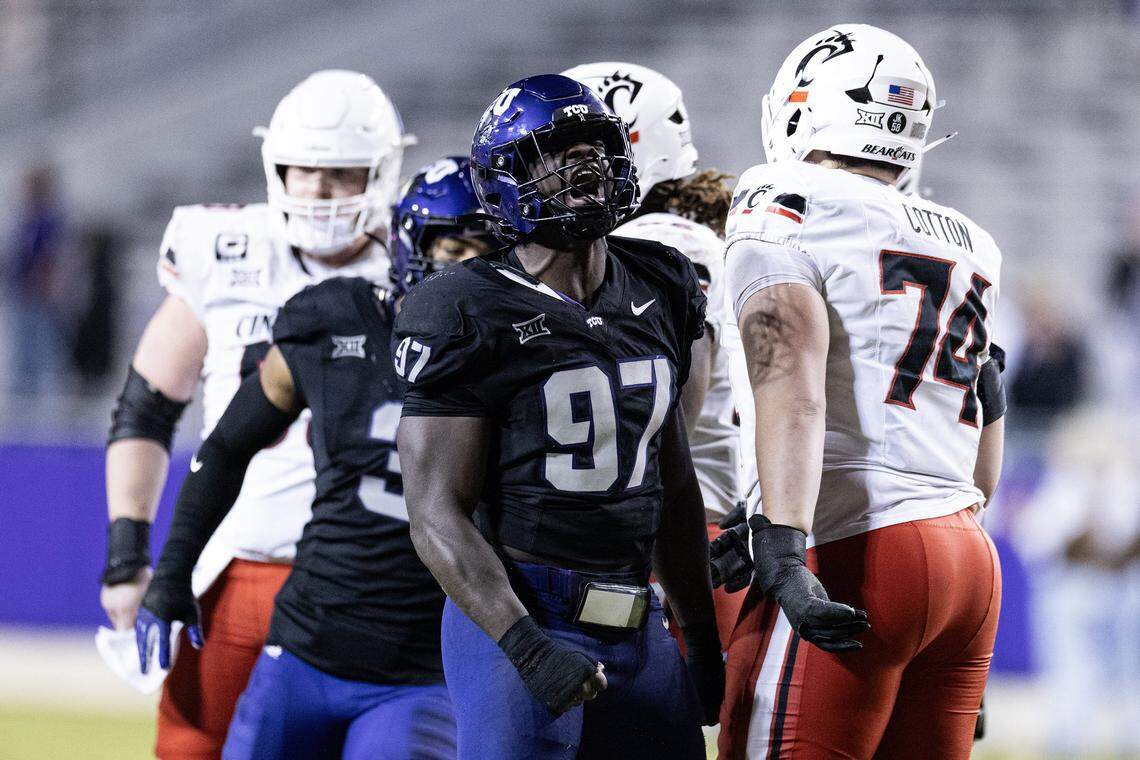 TCU defensive end Paul Oyewale (97) celebrates after sacking Cincinnati quarterback Brendan Sorsby (2) in the second half of a Big XII conference game between the TCU Horned Frogs and the Cincinnati Bearcats at Amon G Carter Stadium in Fort Worth on Saturday, Nov. 29, 2025.