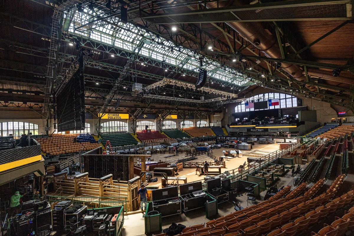Workers begin to work on transforming the inside of the Cowtown Coliseum for the 2024 MLB Draft in the Fort Worth Stockyards on Thursday.