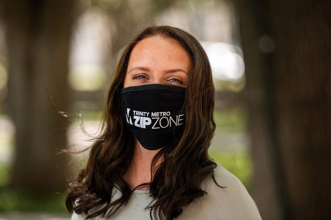 Trinity Metro employee Sarah Esquivel tries on a Zipzone face mask.