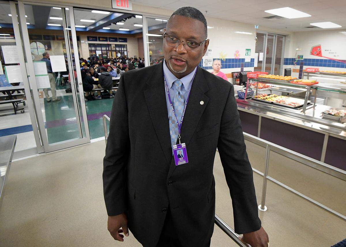 Everman ISD Superintendent Curtis Amos stands in the school cafeteria at Charles Baxter Junior High School in Everman, TX, Thursday, April 19, 2018.