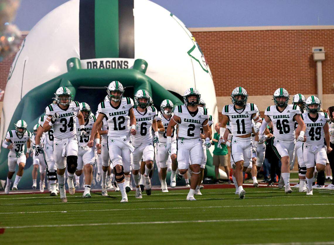 The Southlake Carroll Dragons enter the field to face Eaton in a District 4-6A high school football game played at Northwest ISD Stadium on Thursday, October 21, 2021, in Justin. (Steve Nurenberg/Special to the Star-Telegram)