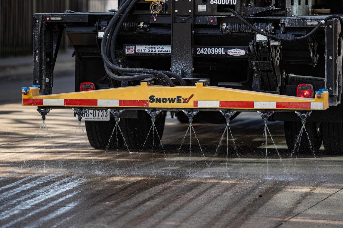 A city-sanction brine truck sprays brining solution on the street in preparation for the winter storm on Presidio Street in Fort Worth on Wednesday, Jan. 8, 2024.