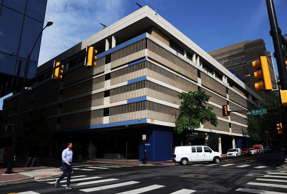 A pedestrian crosses Taylor Street on Tuesday, April 16, 2024, in downtown Fort Worth. Dickies relocated its headquarters last summer from West Vickery Boulevard to The Tower complex in the heart of town in downtown​.