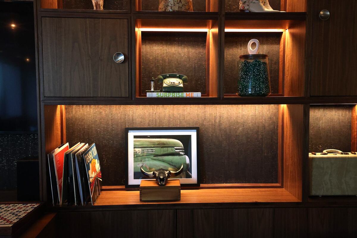 Le Meridien Downtown Fort Worth features a library near the sixth floor pool deck as a air conditioned getaway.