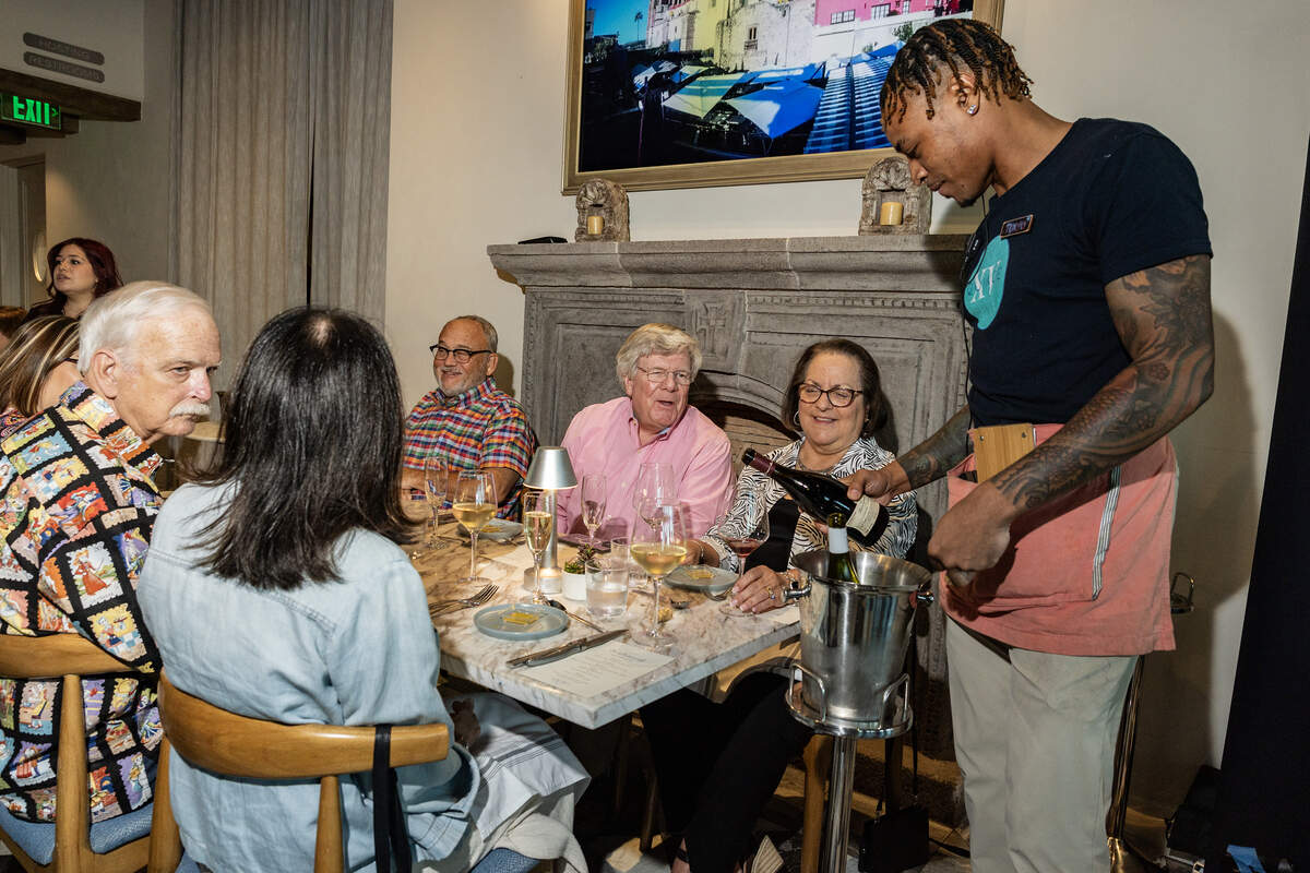 Event attendees speak with each other at the Eats Beat Dinner with Bud at Quince in Fort Worth on Tuesday, Oct. 28, 2025.