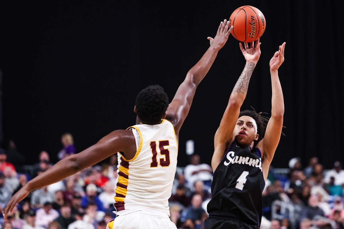 Mansfield Summit guard Jaxon Sneed (right) takes a shot over the hands of a Beaumont United defender during the Class 5A Division II state championship game Saturday at the Alamodome in San Antonio.