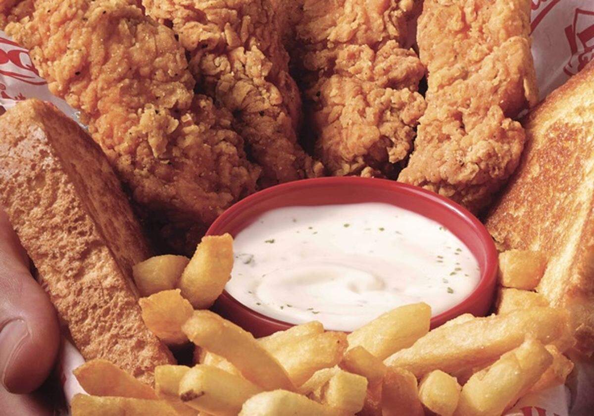 Spicy chicken fingers with cream gravy in a Country Basket at Dairy Queen.