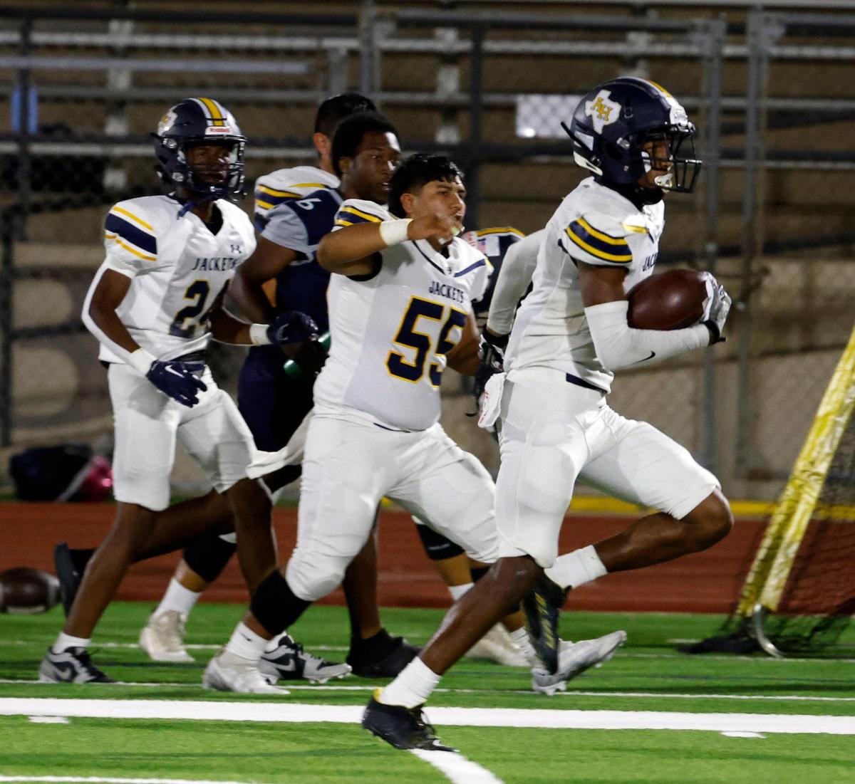 Height’s Keith Guidry intercepts a pass and takes it to the end zone untouched for six in the first half of a UIL football game at Clark Stadium in Fort Worth, Texas, Friday, Sept. 29, 2023.
