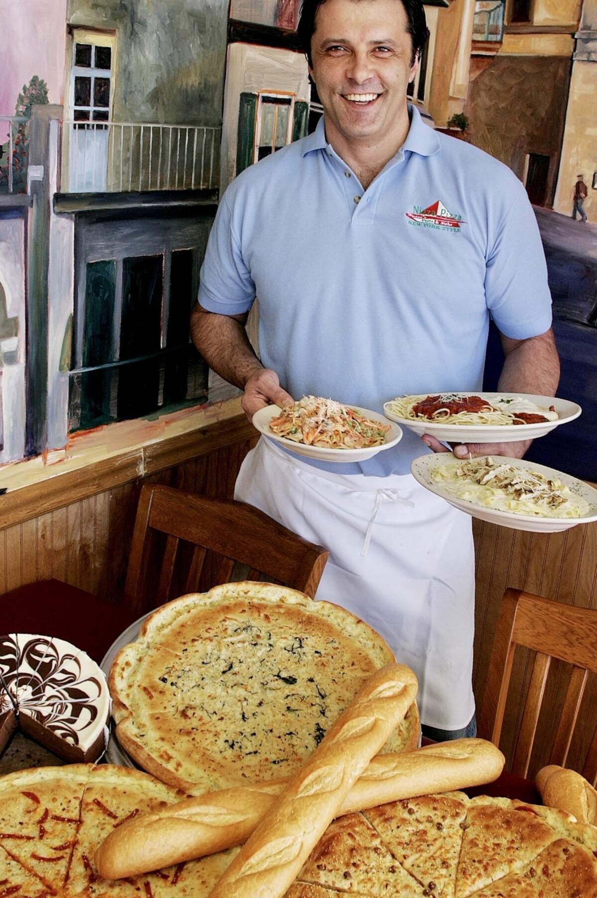 Hysen Lushaj was much younger when he opened an Arlington restaurant before moving to Fort Worth and Colleyville.