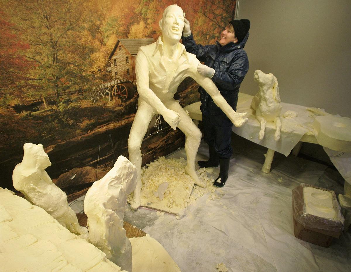 Sept. 21, 2005: Sharon BuMann works in a refrigerated display case as she sculpts Elvis and three hound dogs out of 800 pounds of butter in the arts and crafts building at Fair Park in Dallas. The finished work will be on display throughout this year’s State Fair of Texas.