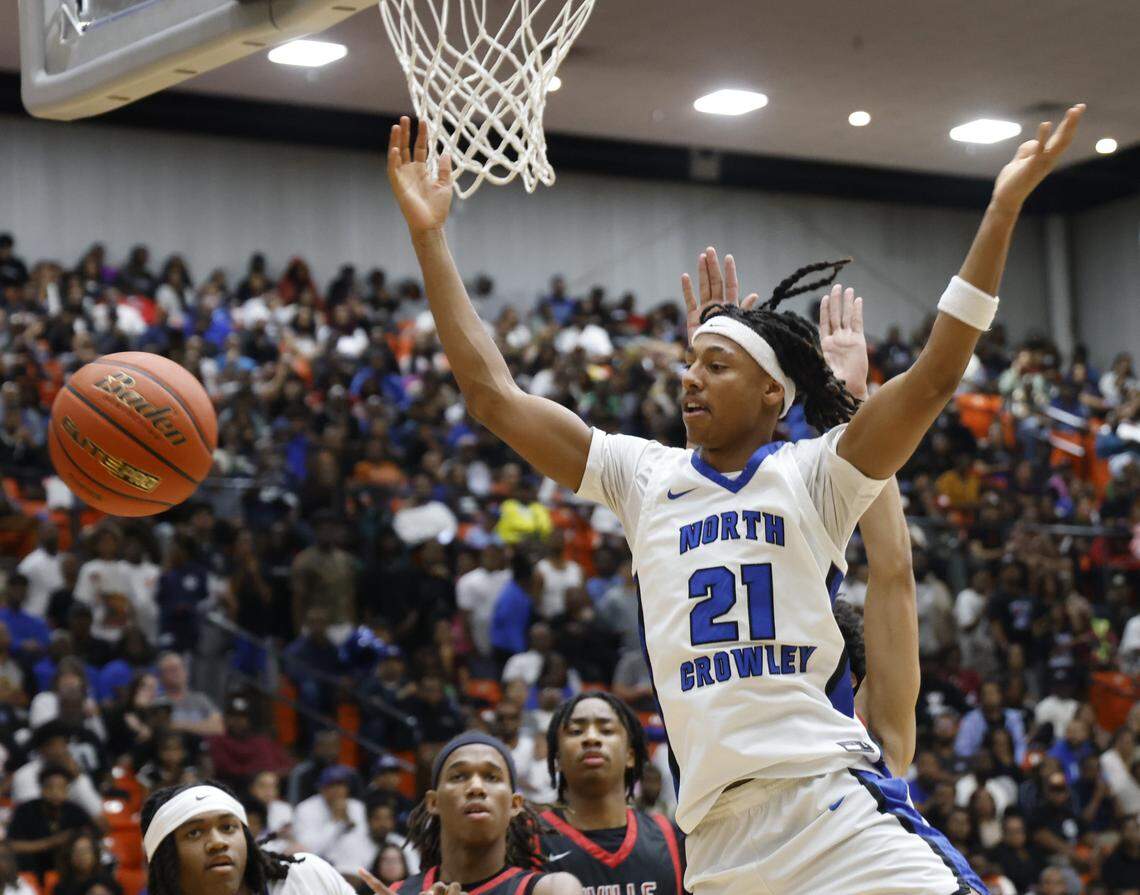 North Crowley wing Jonathan Fox (21) has the ball knocked away by a Duncanville defender during the first half of a UIL Class 6A Division I boys semifinal basketball game at Wilkerson Greines Activity Center in Fort Worth, Texas, Monday, Mar. 10, 2026.