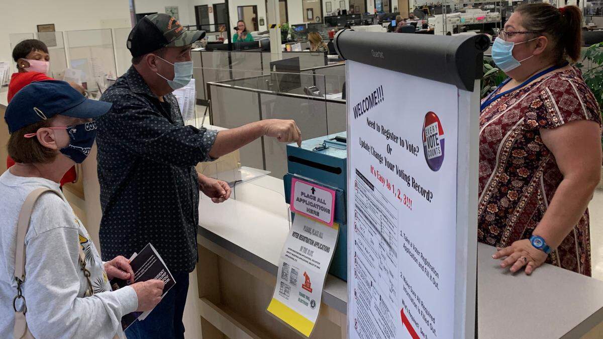 Residents drop off their voter registration documents at the Tarrant County Election Administration office in north Fort Worth.