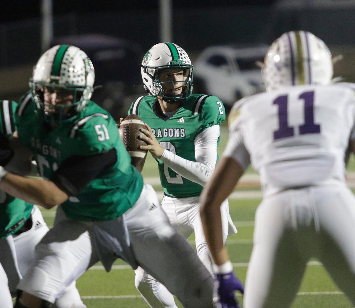 Southlake Carroll’s Angelo Ronda looks for a receiver during a UIL football game at Dragon Stadium on Friday, Sept. 27, 2024.