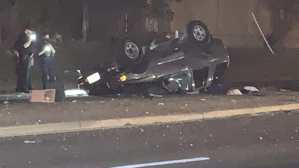 Dallas police officers investigate a fatal rollover crash that occurred Thursday evening in the 9200 block of Garland Road. A 35-year-old man died after he crashed into a steel light pole and caused his car to flip over.