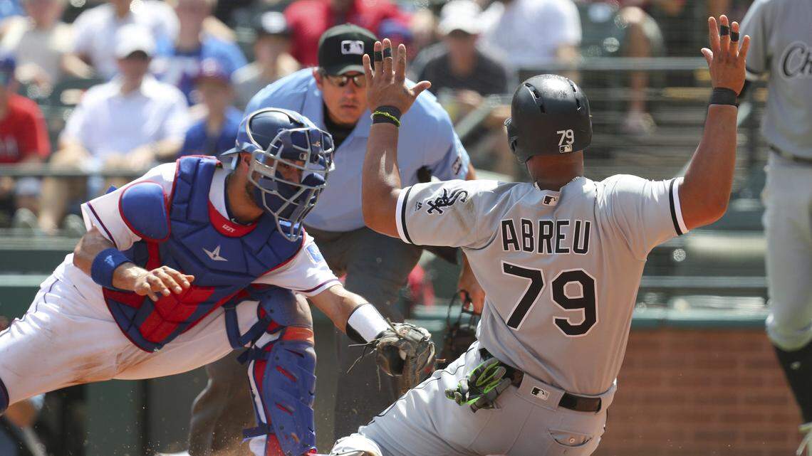 Jose Abreu was just safe ahead of a tag from Rangers catcher Isiah Kiner-Falefa during the White Sox's five-run fifth inning Sunday.