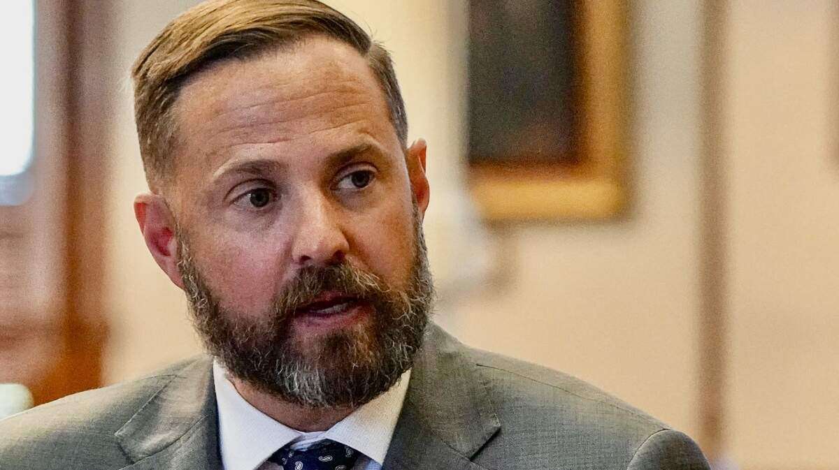 Texas Rep. Dustin Burrows speaks to a colleage in the House Chamber at the Texas Capitol on Thursday, July 13, 2023.