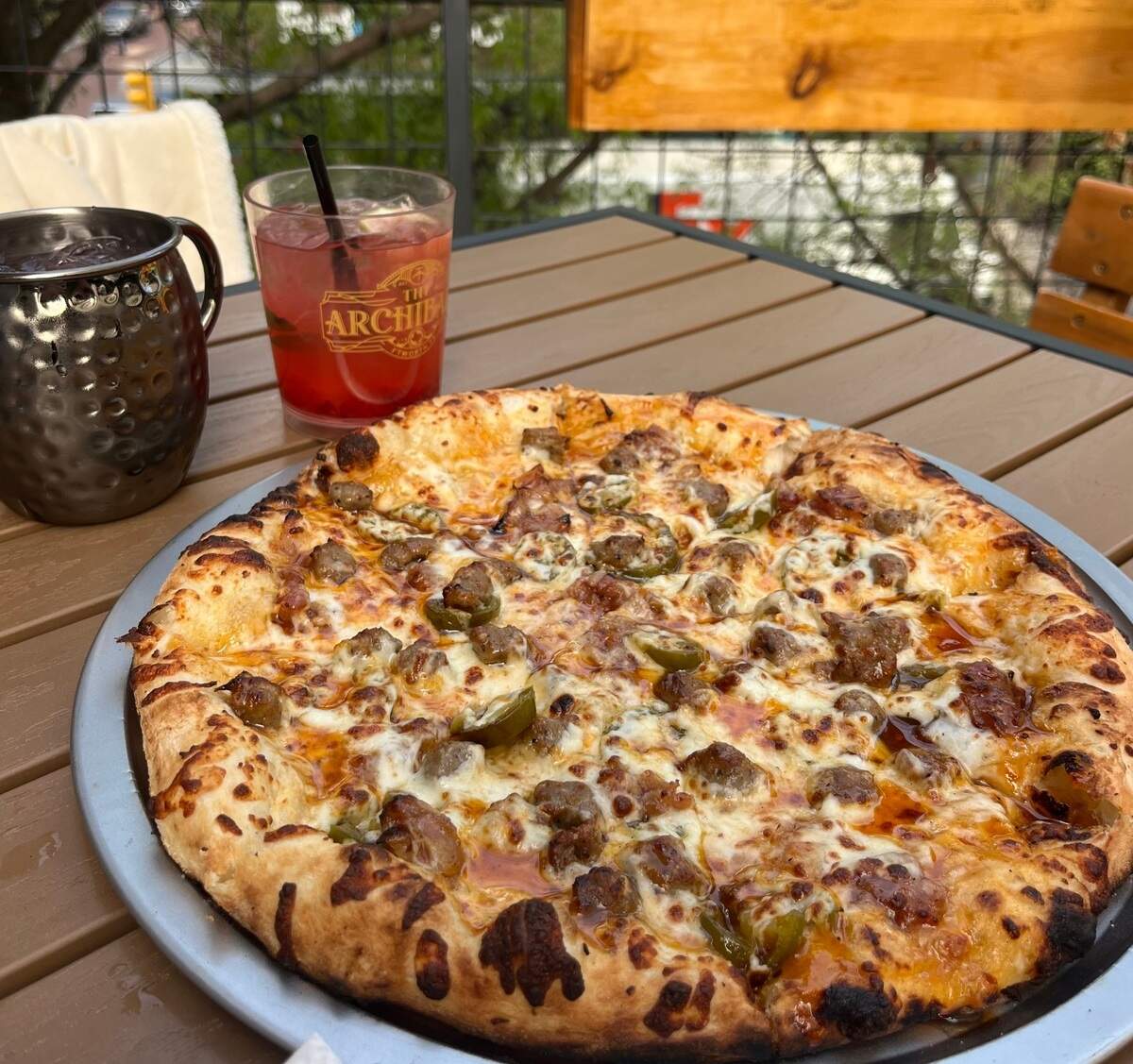 The Angry Pig Pizza, topped with sausage, bacon, jalapenos, and spicy honey, I enjoyed with a Berry Nice mule and raspberry mojito.