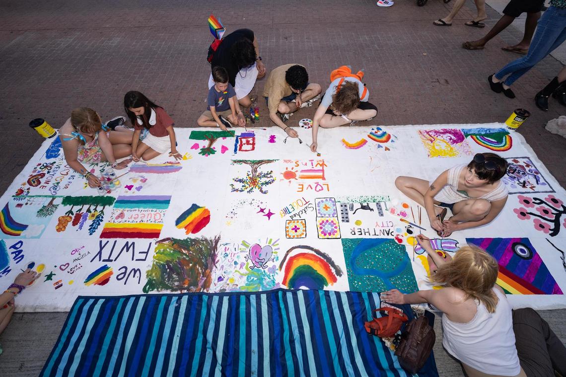 Event participants make Pride-themed art as part of Trinity Pride Fest on South Main Street in Fort Worth on Saturday, June 28, 2025.