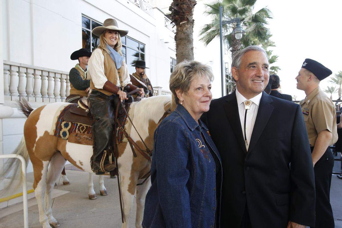 Kristin Jaworski, left, of the Fort Worth Herd has her photograph taken with Maurine and Ernest Conner outside the black tie gala celebrating the USS Fort Worth in Galveston, Texas, on Sept. 21, 2012.