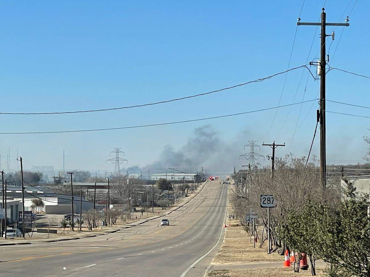 Emergency crews are on the scene of a grass fire near Kennedale in southeast Tarrant County, Texas, on Tuesday, Feb. 15, 2022. The fire was reported near Kennedale Parkway and people were being evacuated from the area.
