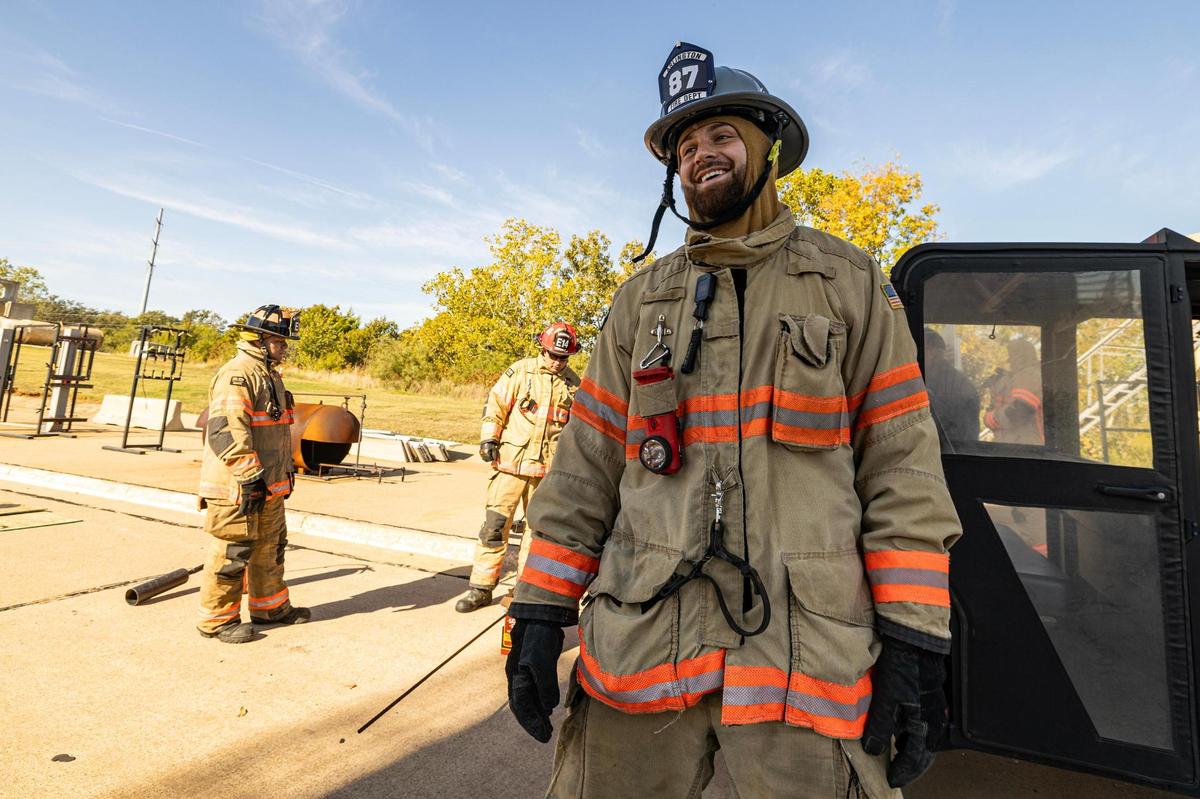 Dallas Cowboys tight end Jake Ferguson wears his custom-made firefighter helmet with a full firefighter uniform during a Turkey Fryer Fire Safety demonstration at the Arlington Fire Department Training Facility Station 14 in Arlington on Tuesday, Nov. 14, 2024.