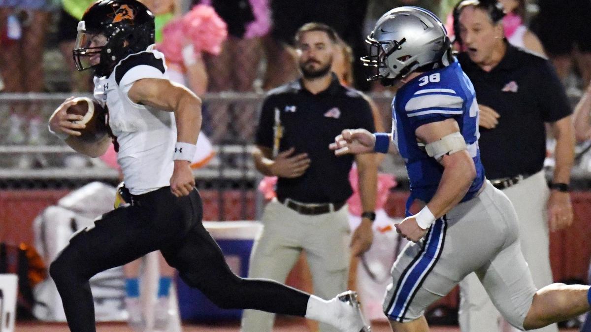 Aledo quarterback Hauss Henjy, left runs away from Centennial’s Cade Lee for a touchdown to take a 28-6 lead in the second quarter of Friday’s October 14, 2022 District 3-5A Division 1 football game at Burleson ISD Stadium in Burleson, Texas. Special/Bob Haynes