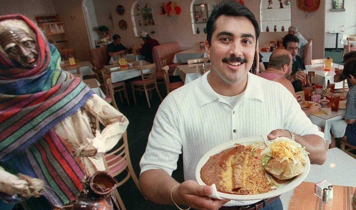 Michael Nevares, co-founder of Miguelito’s Mexican Restaurant in Hurst, Texas, shows off the Gabriela dinner on June 13, 1997. Nevares died in 2004.