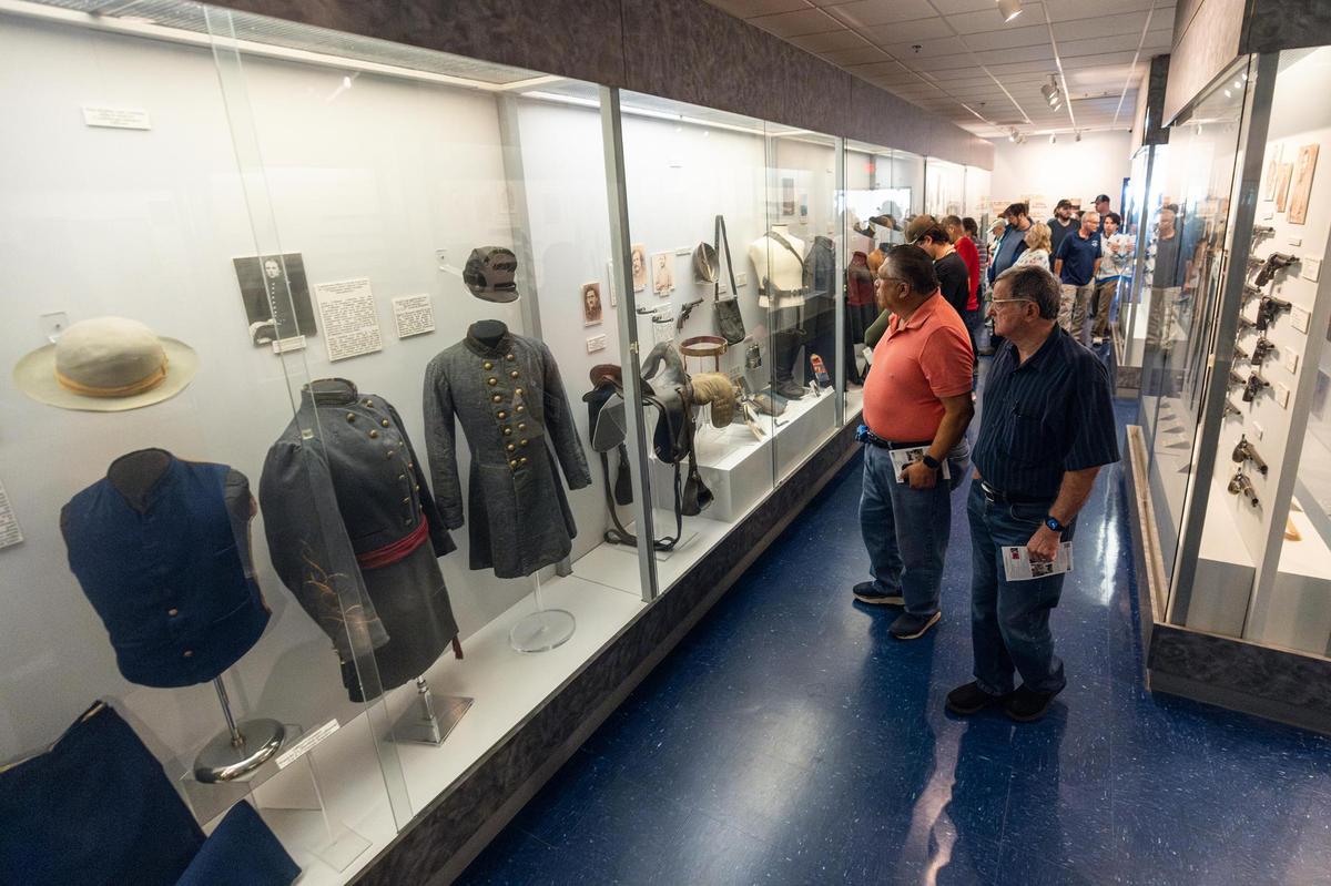 Museum visitors take a look at the artifacts on display at the Texas Civil War Museum. The museum welcomed its final visitors Oct. 31.