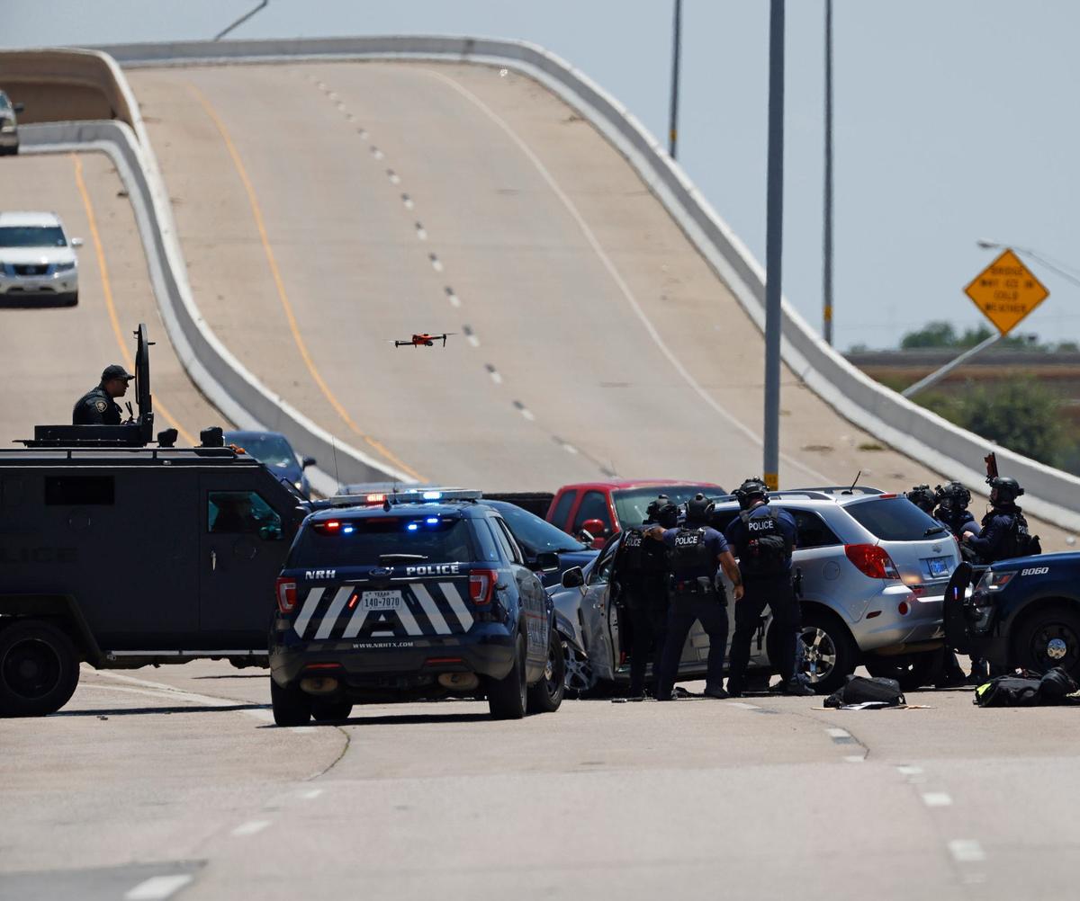 A police standoff in North Richland Hills on Davis Boulevard on Saturday, Aug. 3, 2024, ended when officers fired several rounds of gas through the suspect’s front windshield. The suspect was taken into custody.