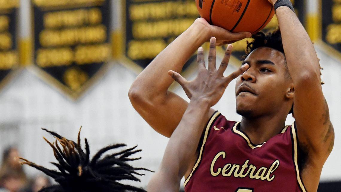 Fossil Ridge’s Dariun Allen, left tries to block Central’s Latrell Jossell as he takes a jump shot during the fourth period of Tuesday’s January 28, 2020 basketball game at Fossil Ridge High School in Keller. Texas. Central went on to win 54-45. Special/Bob Haynes