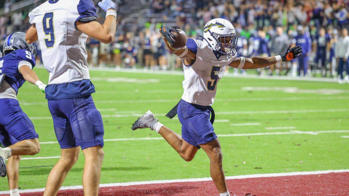 Keller’s Quintin Shropshire celebrates his 4-yard TD run with 1:03 left in the game to give the Indians a 48-45 victory over Eaton at Northwest ISD Stadium in Justin, Texas, Friday, Nov. 7, 2025.