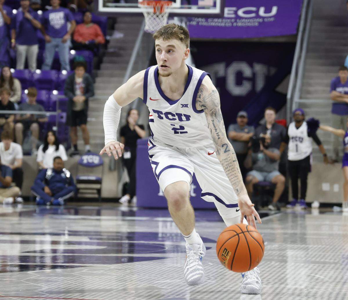 TCU guard Brock Harding (2) dribbles into the key during the second half of a NCAA basketball game between New Orleans University and TCU at Schollmaier Arena in Fort Worth, Texas, Monday Nov. 03, 2025. The Horned Frogs dropped their home opener 78-74 to the Privateers.