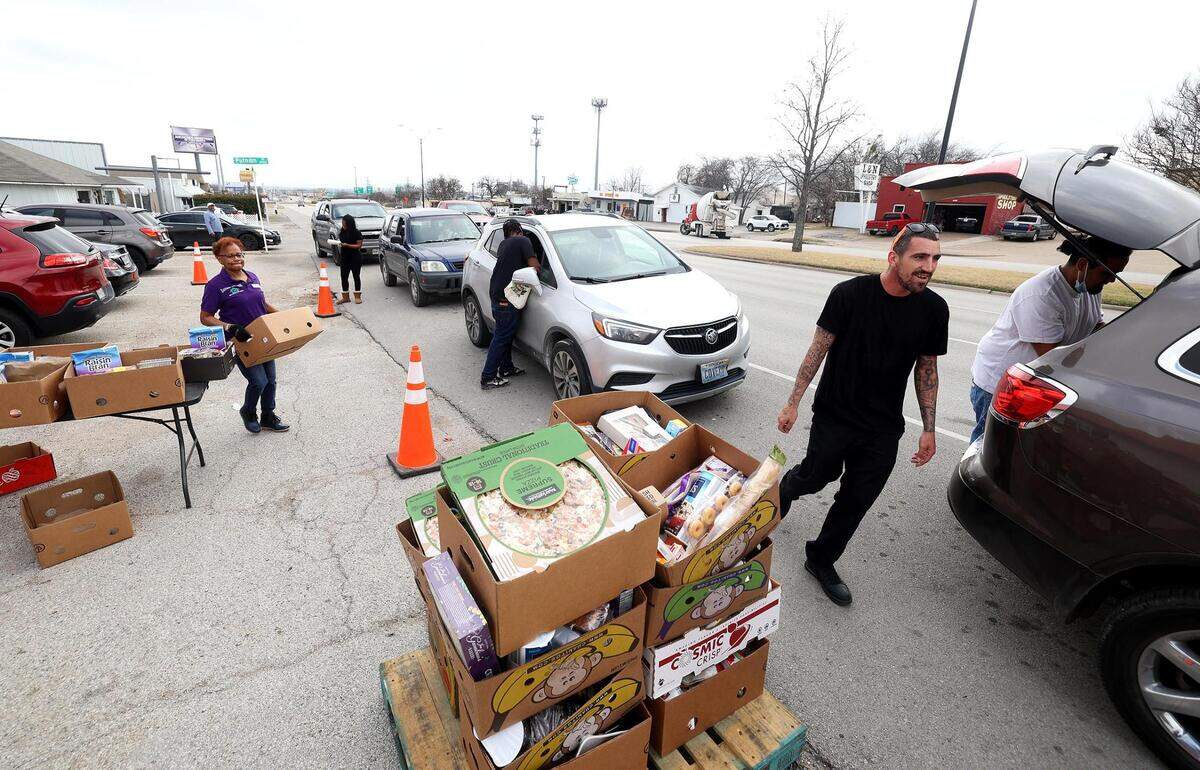 Eastside Ministries distributes food to those in need on Friday, February 2, 2024, in Fort Worth. The nonprofit converted to a drive-through method for food distribution after in late November heavily damaged their food pantry area. A suspect has been arrested on charges of arson.