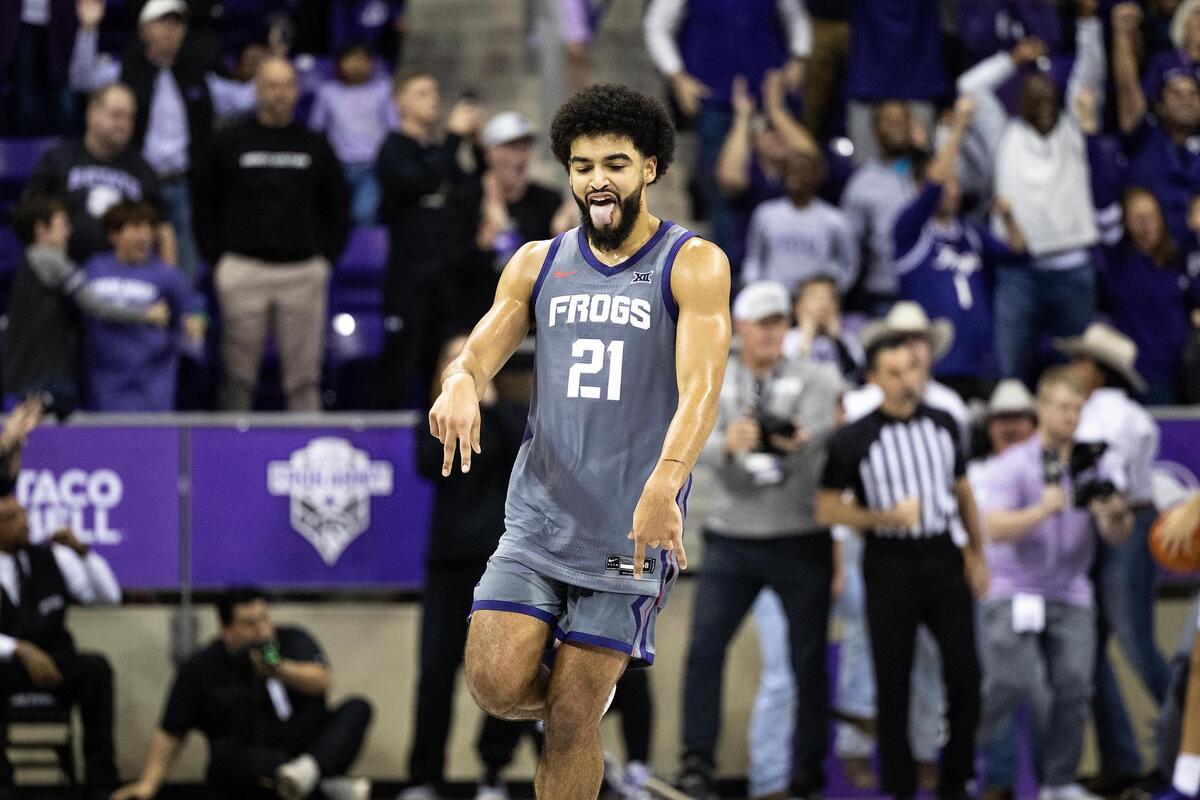 TCU guard Noah Reynolds (21) celebrates after making the game-winning shot at the end of the second half of an NCAA game between TCU and Kansas State at Schollmaier Arena in Fort Worth on Saturday, Jan. 4, 2025.