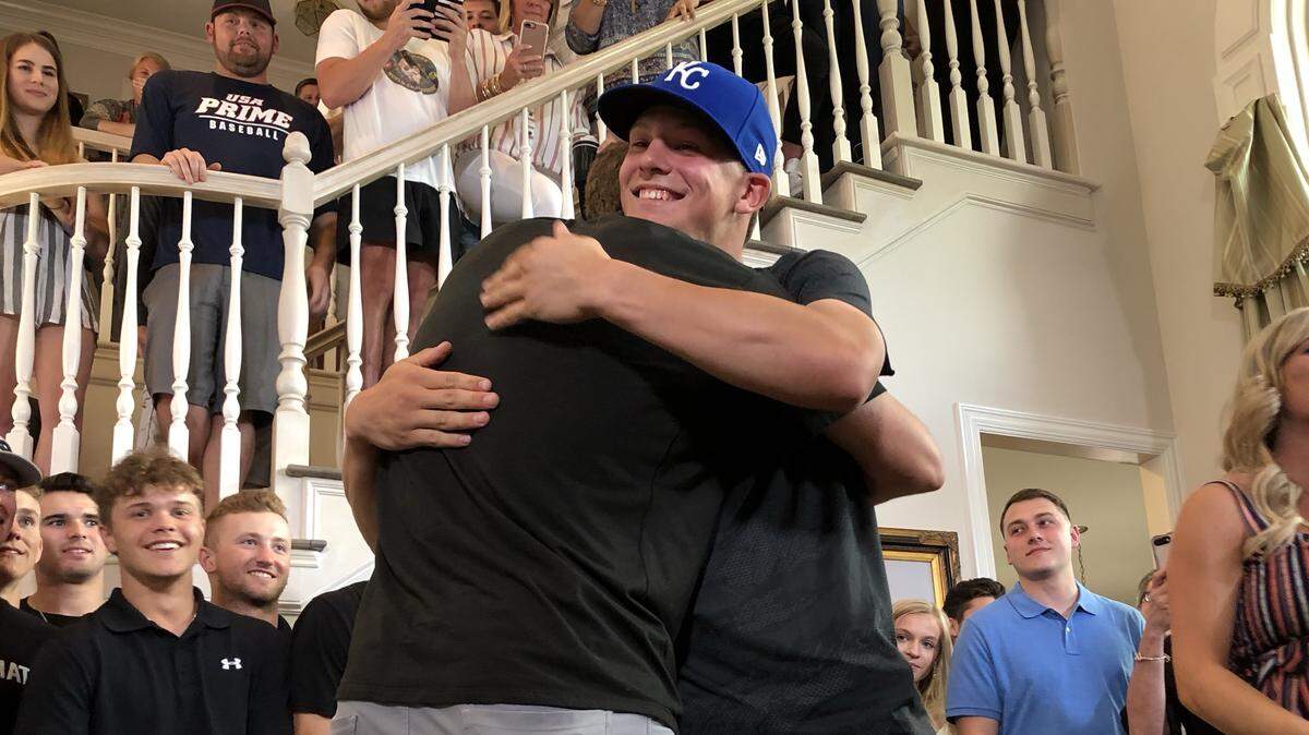 Bobby Witt Jr., right, embraces his father, Bobby Witt, shortly after he was selected Monday by the Royals with the second overall pick in the MLB draft.