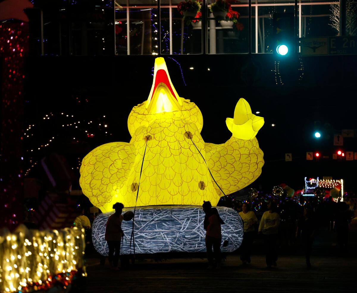 Air had to be let out of the Big Bird float so he could pass under a pedestrian walkway during the 2024 Parade of Lights.