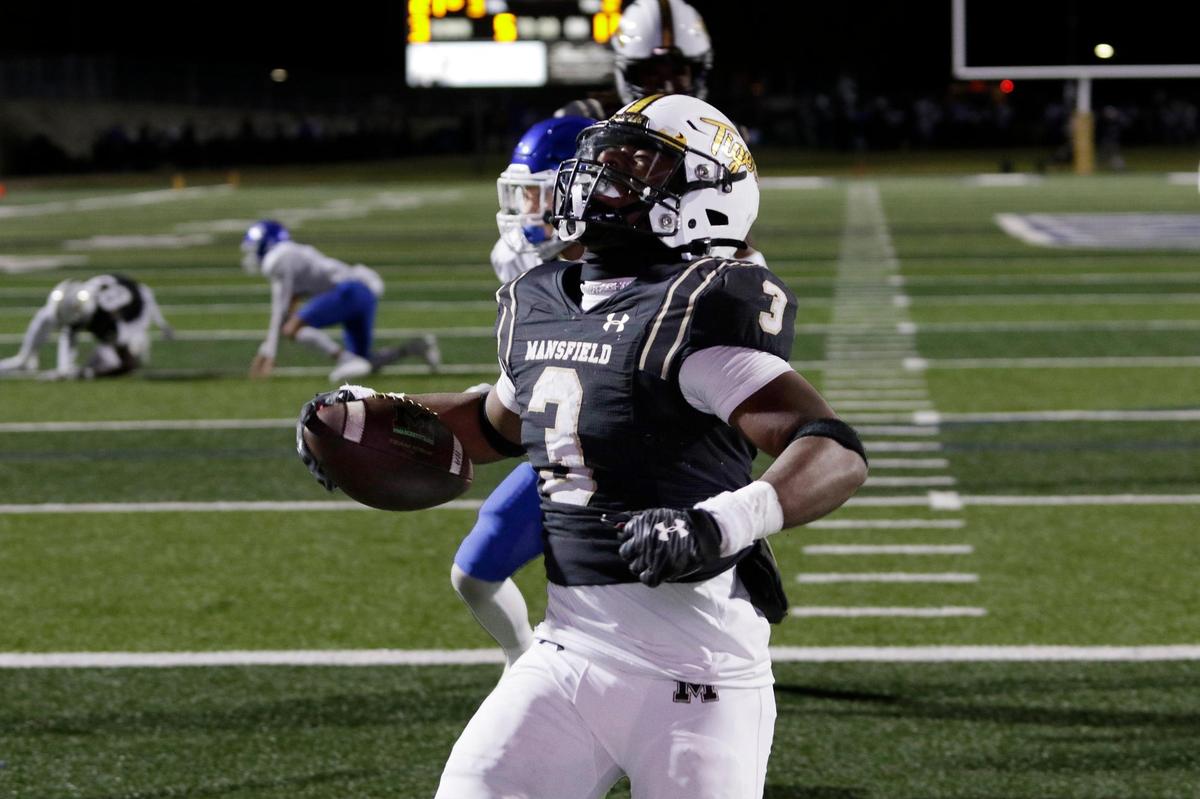 Mansfield’s Teddy Clark lets out a scream after scoring a touchdown during a UIL football game at Vernon Newsome Stadium on Friday November 8, 2024.