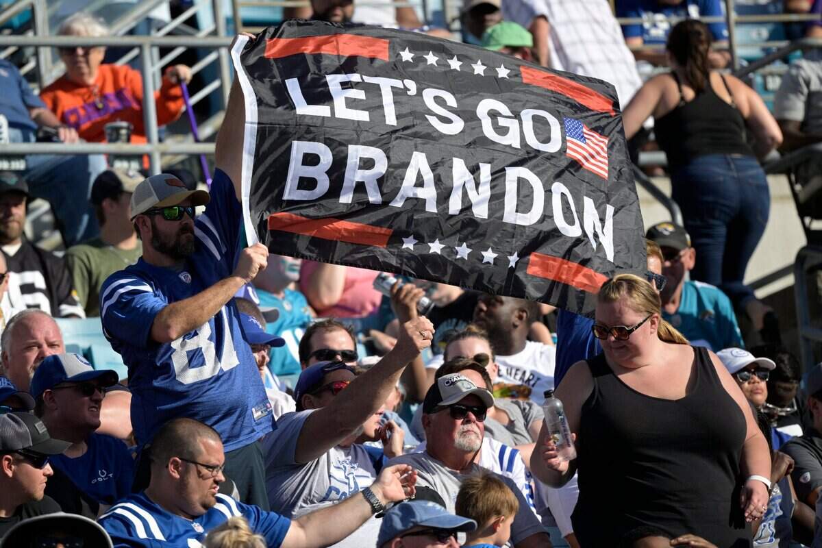 Indianapolis Colts fans display a Let’s Go Brandon flag in the stands during the second half of an NFL football game against the Jacksonville Jaguars, Sunday, Jan. 9, 2022, in Jacksonville, Fla. (AP Photo/Phelan M. Ebenhack)