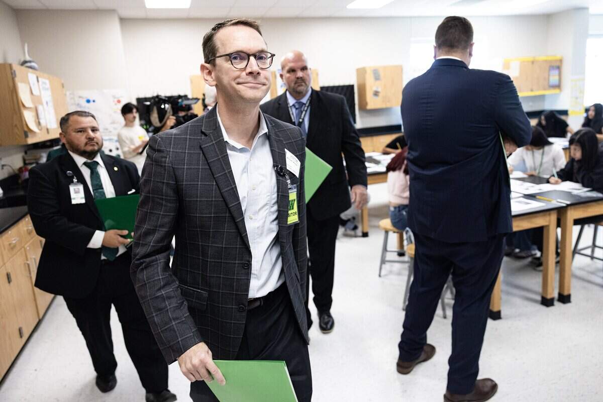 Mike Morath, the Texas Commissioner of Education, walks through a science class at Lucyle Collins Middle School in Lake Worth on Tuesday, Oct. 21, 2025.