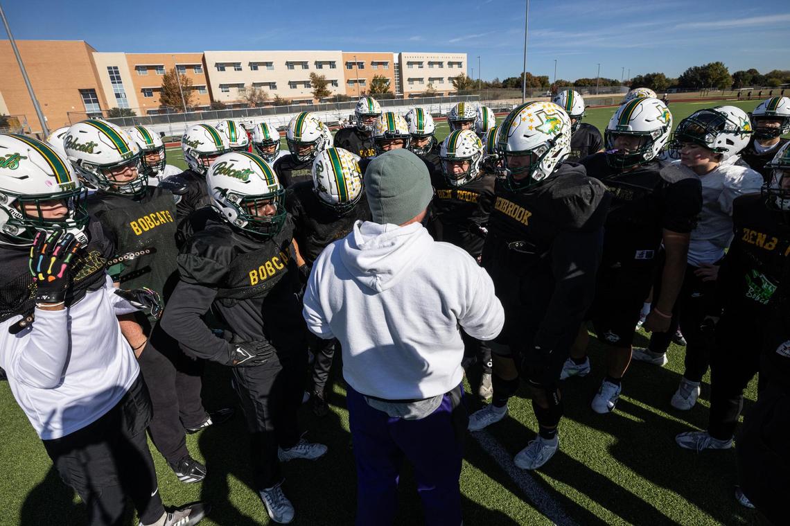 Fort Worth Benbrook defensive coordinator Wade Cribbs speaks to the defense during practice last season. The Bobcats broke a 24-year drought for Fort Worth ISD with their area-round playoff victory.