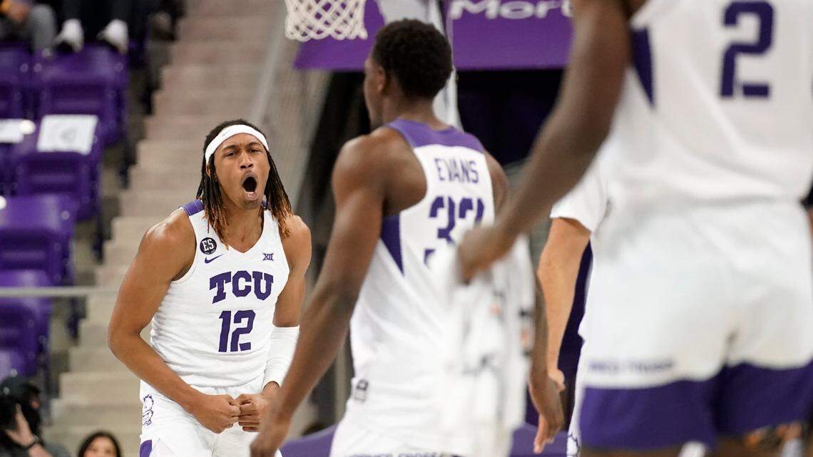 TCU’s Xavier Cork (12), Maxwell Evans (33) and Emanuel Miller (2) celebrate as they take the lead against Nicholls State in the second half of an NCAA college basketball game in Fort Worth, Texas, Thursday, Nov. 18, 2021. (AP Photo/Tony Gutierrez)