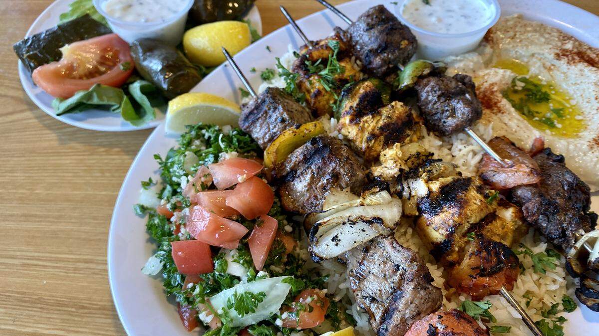 A mixed-grill plate with tabbouleh and hummus at Amira’s Mediterranean in Arlington.