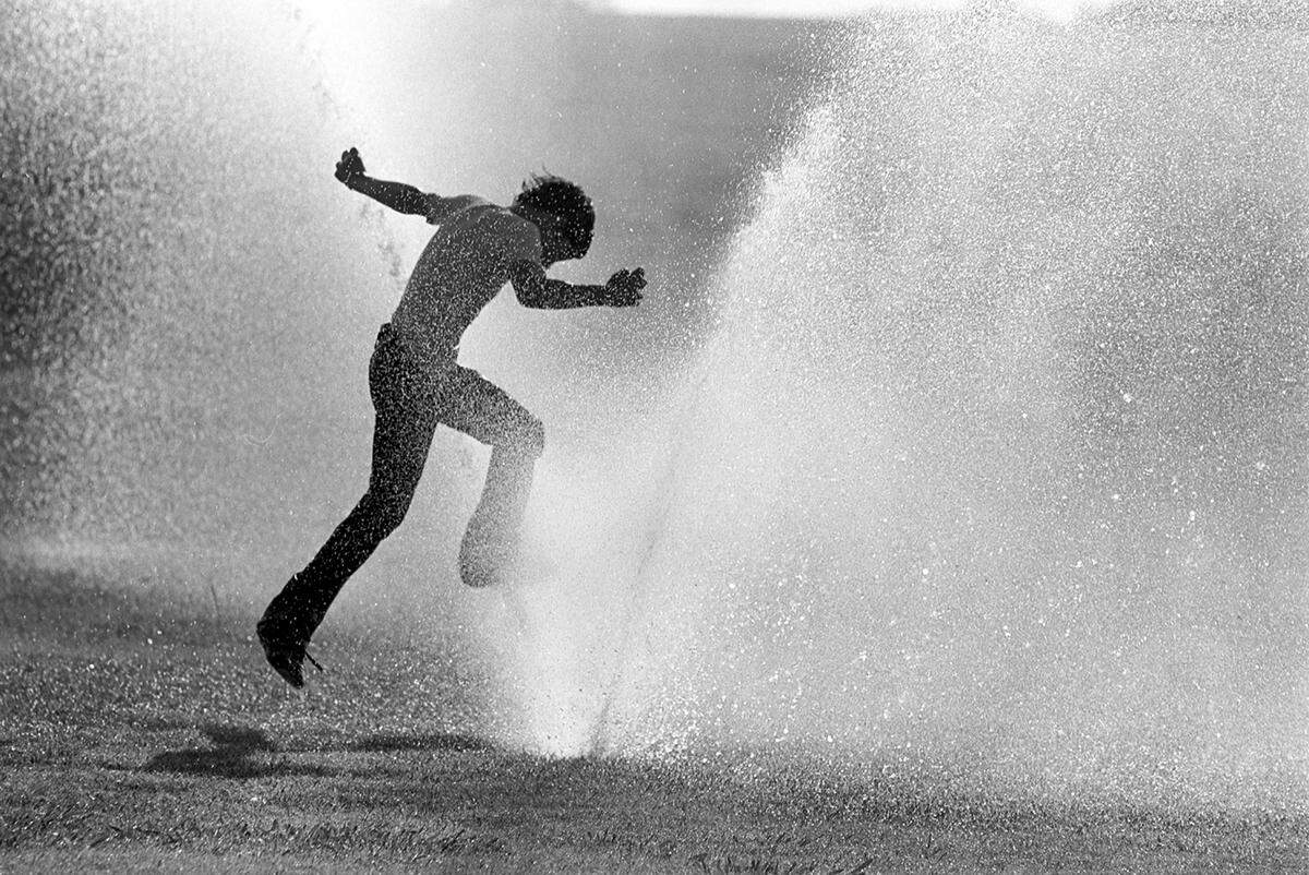 June 16, 1980: Hot weekend weather sent 13-year-old Brant Pate head-over-heels into the sprinkler system at TCU where the high temperature hit 100 degrees.