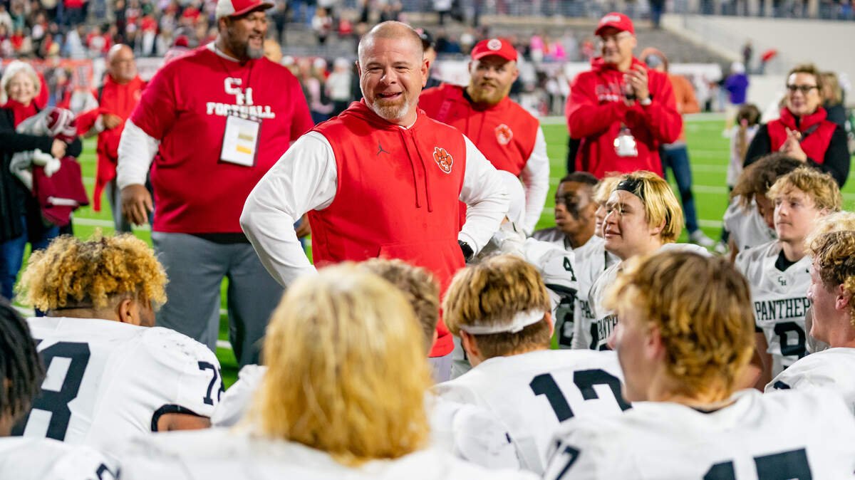 Colleyville Heritage head coach Jerry Edwards speak to his team after a playoff victory against Argyle.