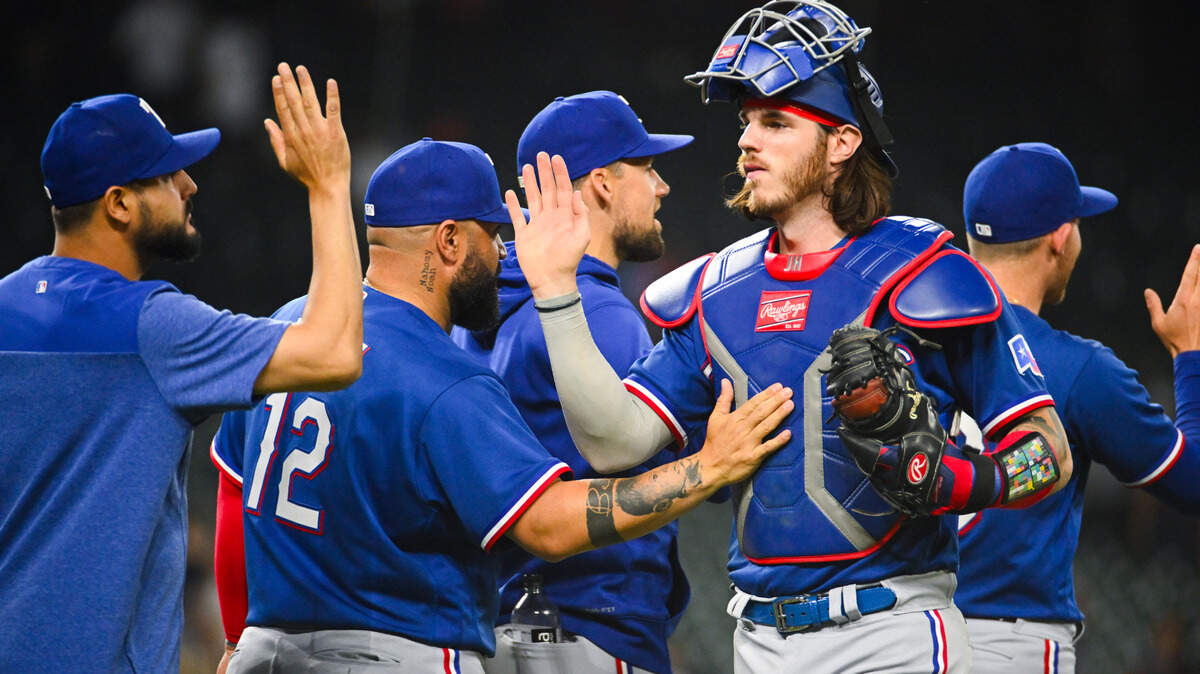 Texas Rangers catcher Jonah Heim (28) celebrates with teammates after the game against the Detroit Tigers at Comerica Park.
