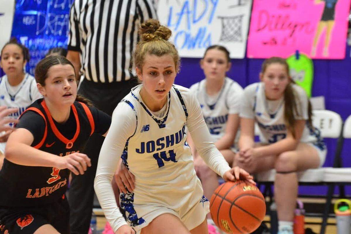 Joshua’s Chloe Griswell (14) drives to the basket against Aledo in a girls UIL Class 5A Division I area playoff game on Thursday, February 19, 2026 at Godley High School in Godley, Texas.