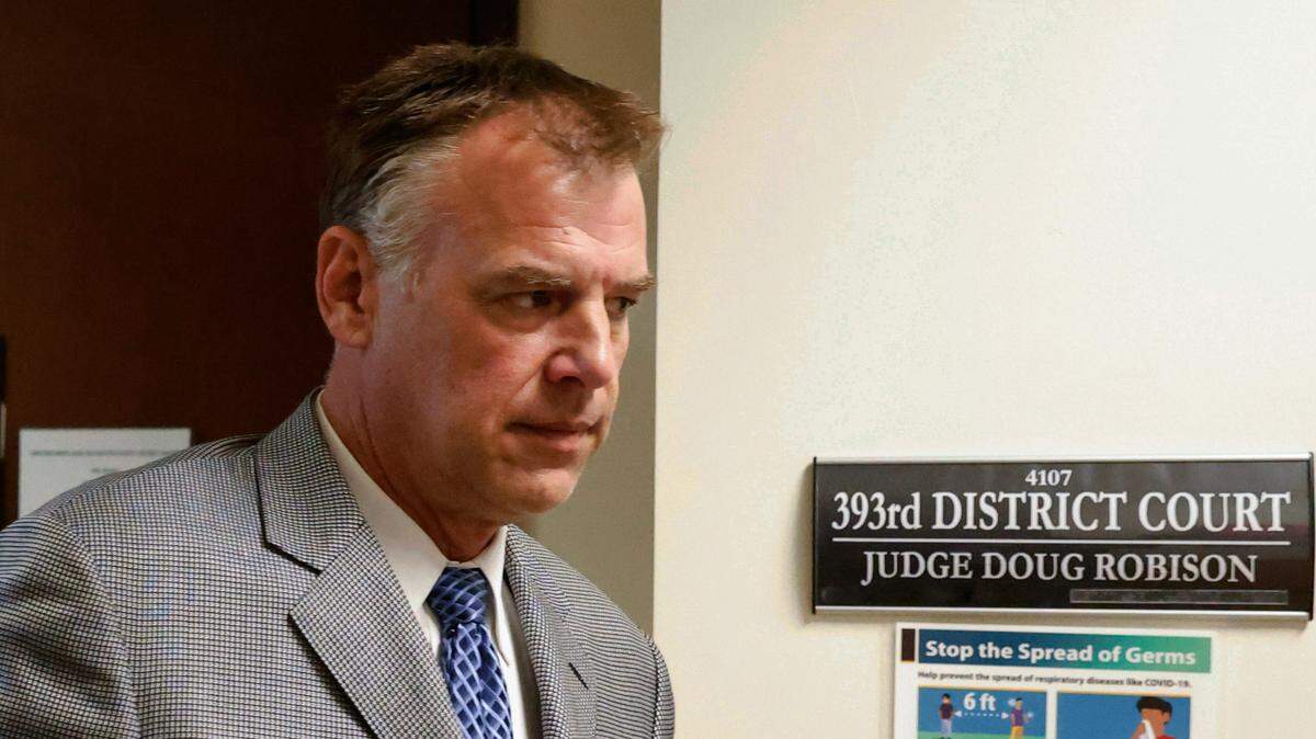 Former Texas Rangers pitcher John Wetteland leaves the courtroom after the judge declared a mistrial in his sexual abuse trial when jurors said they were deadlocked on Friday, Sept. 2, 2022, in Denton, Texas.