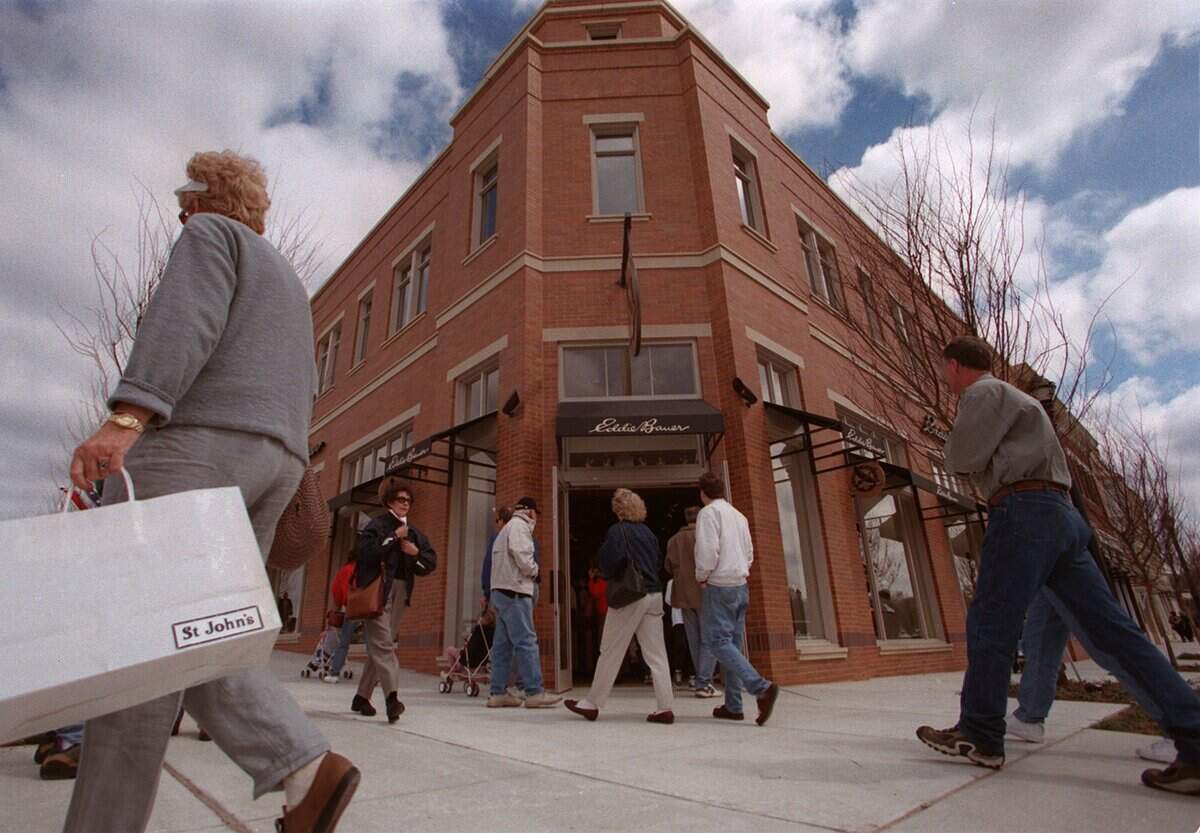 March 20, 1999: Shoppers stroll along the sidewalk outside the Eddie Bauer store during the grand opening of Southlake Town Square.